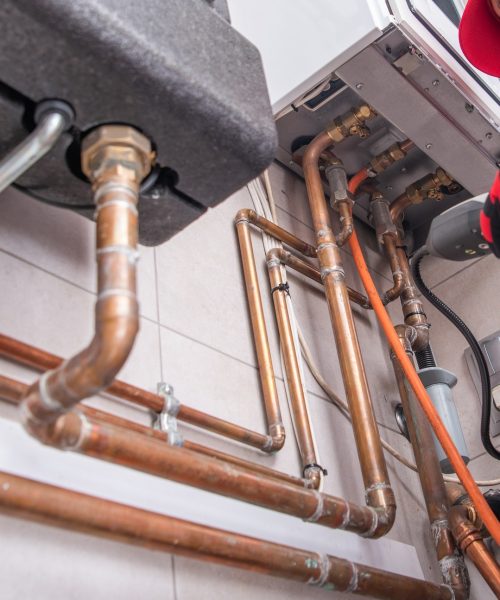 Heating Specialist with Gas Leak Detector in His Hand